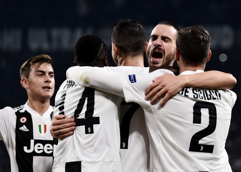 Juventus players congratulate Cristiano Ronaldo after the Portugguese striker gave the Italians a 1-0 lead. AFP