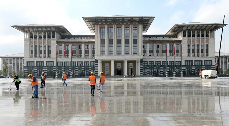 Workers clean the area in front of the new Turkish presidential palace, ahead of an official reception for Republic Day in the capital Ankara, on October 28, 2014. Stringer/EPA