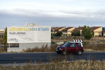 A billboard reading "Spain's first bioclimatic city" sits on the perimeter of a semi-abandoned residential development in Bernuy de Porreros, near Segovia, Spain, on Monday, Oct. 15, 2018. The volume of residential mortgages sold in Spain peaked in late 2005 before hitting a low in 2013. Photographer: Angel Navarrete/Bloomberg