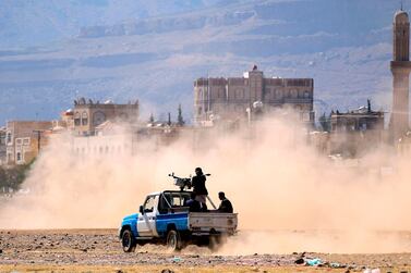 Fighters travel in an armed pickup truck in Sanaa, Yemen's rebel-held capital. AFP