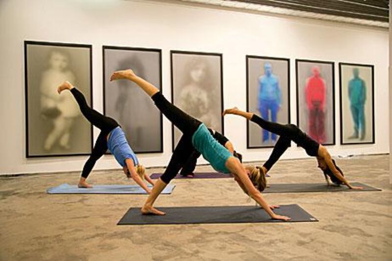 Arty manoeuvres: sessions three times a week at the XVA Gallery in DIFC combine the regular relaxing effects of yoga with the introspective influence of being surrounded by art. Courtesy of Urban Yoga