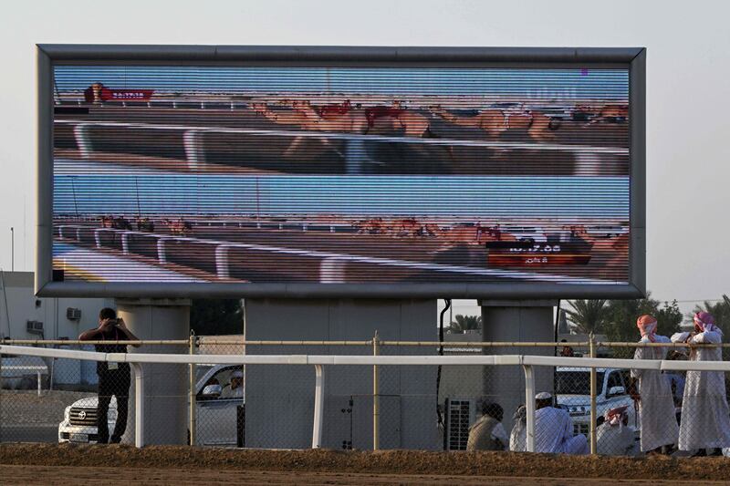 The race is shown on a big screen in Al Sheehaniya. World Cup matches will be shown on vast screens at fan zones across the region