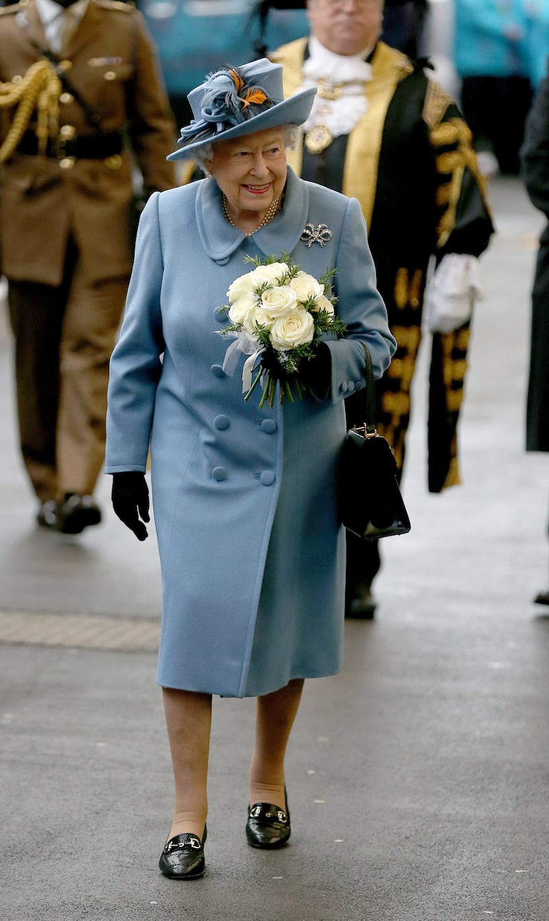 Queen Elizabeth II, in blue, arrives at Hull train station during a visit to the English city on November 16, 2017. Getty Images
