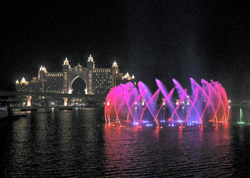 DUBAI, UNITED ARAB EMIRATES. 18 NOVEMBER 2020. 
The Palm Fountain comes alive to the theme of Oman National Day on 18 November. 
(Photo: Reem Mohammed/The National)

Reporter:
Section: