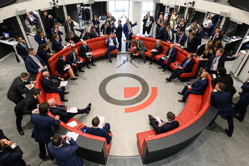 Traders, brokers and clerks shout and gesture on the first day of in-person trading at the London Metal Exchange after the trading ring moved to electronic-only trades in March 2020 amid the Covid-19 pandemic. Getty Images