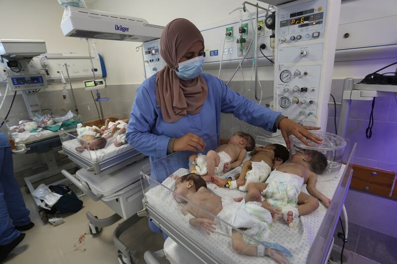 A nurse cares for prematurely born Palestinian babies that were brought from Al Shifa Hospital in Gaza city. AP 