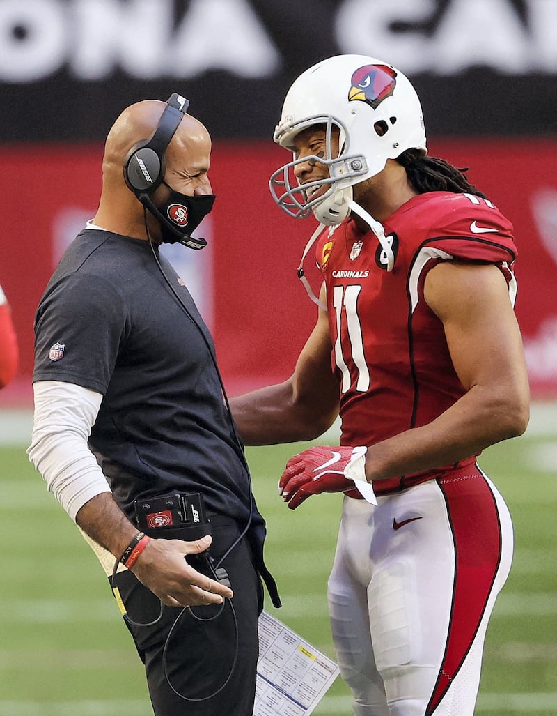 GLENDALE, ARIZONA - DECEMBER 26: Defensive coordinator Robert Saleh of the San Francisco 49ers greets wide receiver Larry Fitzgerald #11 of the Arizona Cardinals during the NFL game at State Farm Stadium on December 26, 2020 in Glendale, Arizona. The 49ers defeated the Cardinals 20-12.   Christian Petersen/Getty Images/AFP (Photo by Christian Petersen / GETTY IMAGES NORTH AMERICA / Getty Images via AFP)