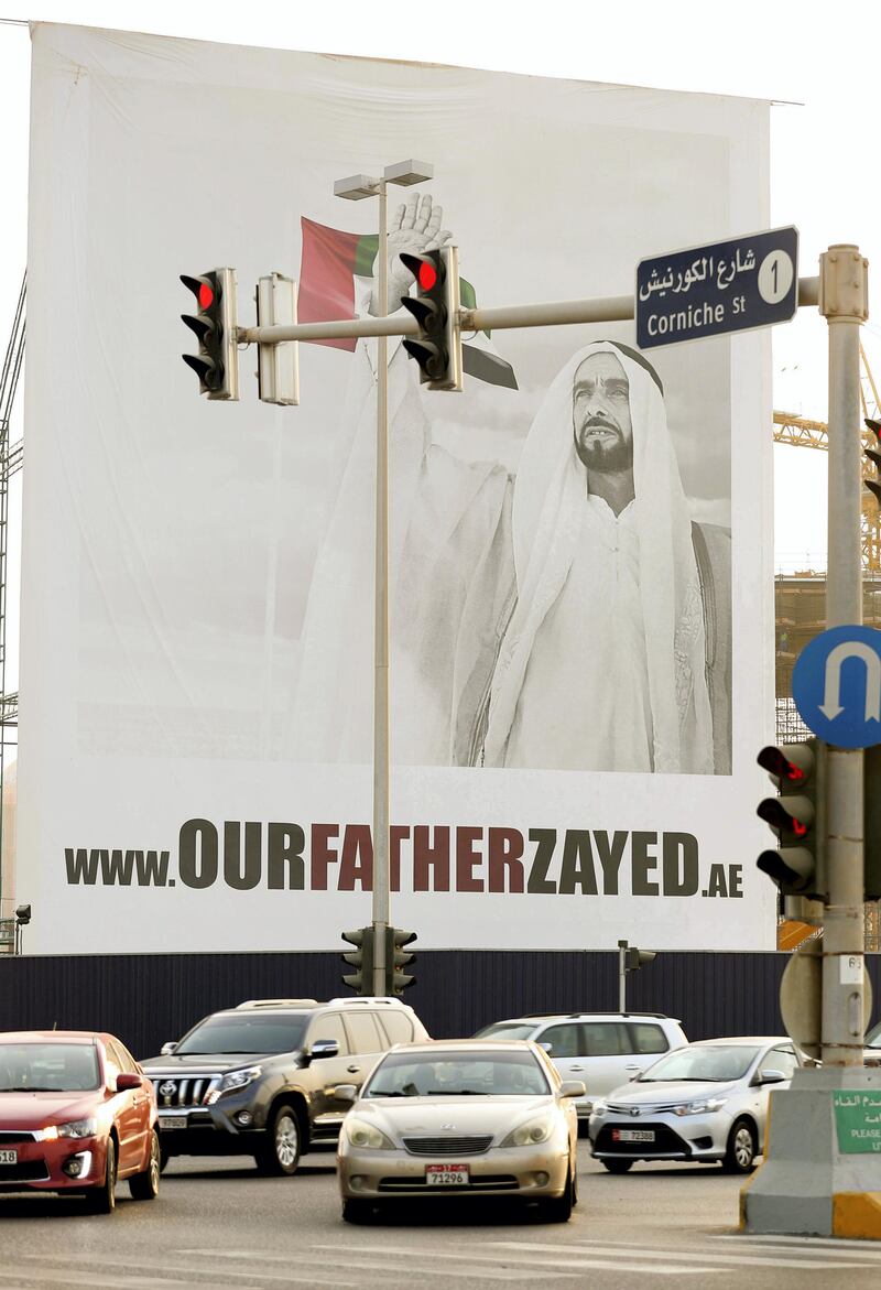 Abu Dhabi, United Arab Emirates, August 06, 2017: Our father Zayed poster with traffic going past on Thursday, Aug. 06, 2017, The Corniche, Abu Dhabi. Chris Whiteoak The National