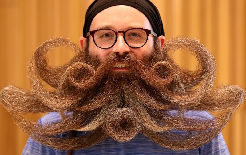 A participant of the international World Beard and Moustache Championships poses before taking part in one of the 17 categories of beard and moustache styles competing in Antwerp, Belgium. Reuters