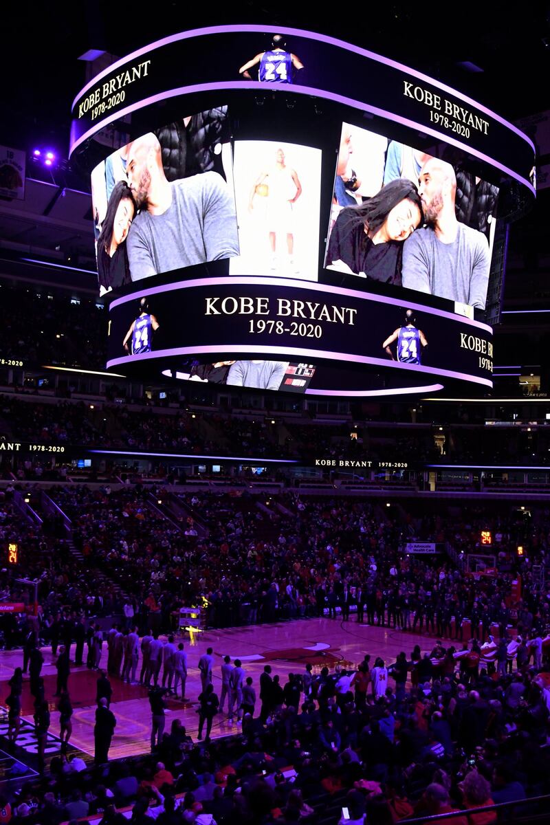 Players and fans stand to honor Kobe Bryant before an NBA game between the Chicago Bulls and the San Antonio Spurs on Monday, January 27. AP