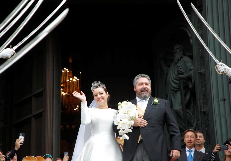 Grand Duke George Mikhailovich Romanov and Victoria Romanovna Bettarini leave St  Isaac's Cathedral after their wedding ceremony in Saint Petersburg, Russia. Photos: Reuters and AFP