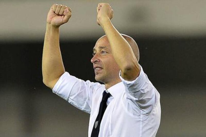 New Chievo coach Eugenio Corini celebrates after starting his reign in charge with a win