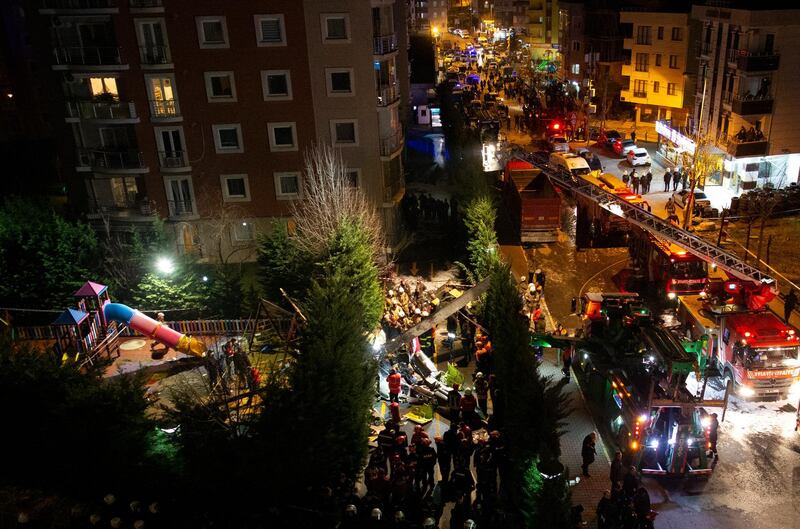 Rescue team and firefighters work after a military helicopter crashed in a garden of a residential area at Cekmekoy District on the Asian side of Istanbul, Turkey. EPA