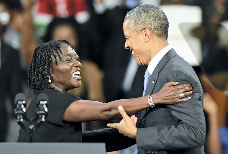 US President Barack Obama (R) embraces his sister Auma at the Moi International Sports centre in Nairobi on July 26, 2015. Obama arrived on July 24 in the Kenyan capital Nairobi, making his first visit to the country of his father's birth since his election as president.  AFP PHOTO/Carl de Souza / AFP PHOTO / CARL DE SOUZA