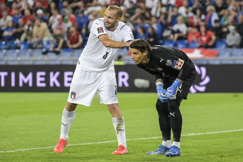 Italy's Giorgio Chiellini, left, congratulates Switzerland's goalkeeper Yann Sommer for a save. EPA