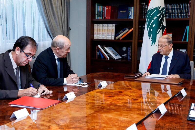 President Michel Aoun holds talks with French Foreign Minister Jean-Yves Le Drian at the presidential palace in Baabda.  AFP