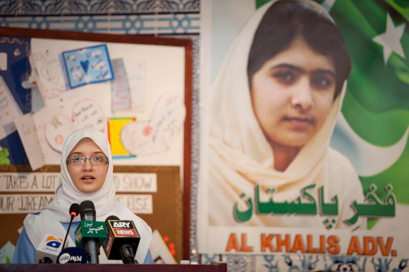 Abu Dhabi, United Arab Emirates - October 15 2012 -   Ayesha Abdul Jalil, 16, speaks at a tribute to Malala Yousufzai at the Embassy of Pakistan in Abu Dhabi. The Embassy held a tribute for the 14-year-old that was shot in the head by the Taliban in the SWAT valley a few days ago. (Razan Alzayani / The National) 