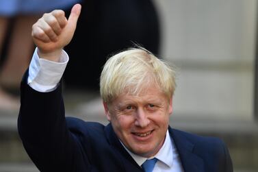 Newly elected leader of the Conservative party Boris Johnson gestures at Conservative party HQ in Westminster on July 23, 2019 in London, England. Jeff J Mitchell/Getty Images