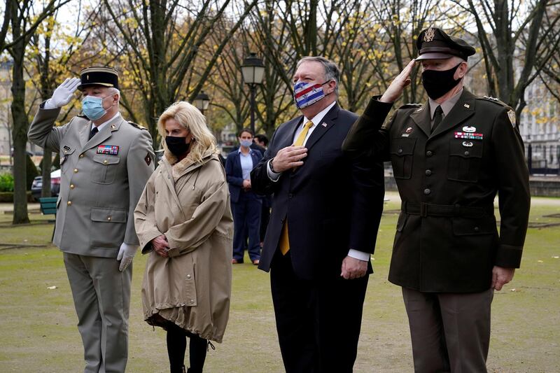 U.S. Secretary of State Mike Pompeo, Deputy Chief of Staff for the Military Governor of Paris Lt. Colonel Jean-Charles Spiteri, U.S. Ambassador to France Jamie McCourt and U.S. Army Lt. Gen. Ricky Waddell participate in a wreath-laying ceremony in homage to victims of terrorism at Les Invalides in Paris, France November 16, 2020. Patrick Semansky/Pool via REUTERS