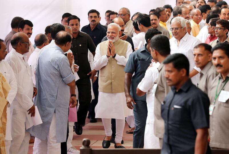 epa06092289 Prime Minister Narendra Modi  (C) greet Indian lawmakers as he leaves after casting his vote at Parliament House during the Indian presidential election in New Delhi, India, 17 July 2017. Lawmakers began voting to elect a new president with ruling Bharatiya Janata Party (BJP) candidate Ram Nath Kovind, who is widely seen as frontrunner for the largely ceremonial post.  EPA/HARISH TYAGI