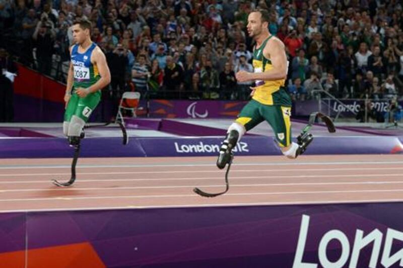 Brazil's Alan Foneles Oliveira and South Africa's Oscar Pistorius battle it out in the T44 200m final at the London 2012 Paralympics