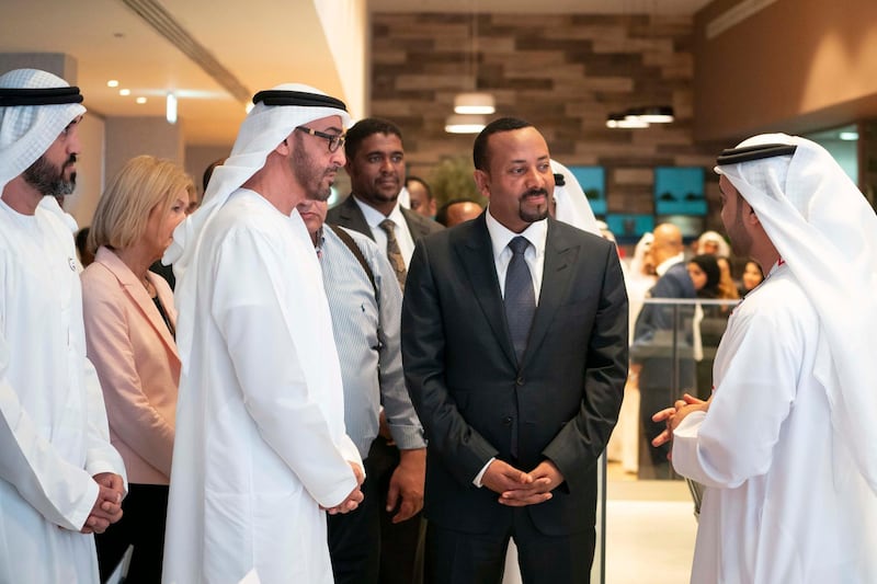 ABU DHABI, UNITED ARAB EMIRATES - March 20, 2019: HH Sheikh Mohamed bin Zayed Al Nahyan, Crown Prince of Abu Dhabi and Deputy Supreme Commander of the UAE Armed Forces (2nd L) and HE Abiy Ahmed, Prime Minister of Ethiopia (3rd L), tour the Special Olympics World Games Abu Dhabi 2019 at Abu Dhabi National Exhibition Centre. Seen with Khalfan Al Mazrouei, Managing Director at Special Olympics World Games Abu Dhabi 2019 (R) and HE Mohamed Mubarak Al Mazrouei, Undersecretary of the Crown Prince Court of Abu Dhabi (L). 

( Mohamed Al Hammadi / Ministry of Presidential Affairs )
---