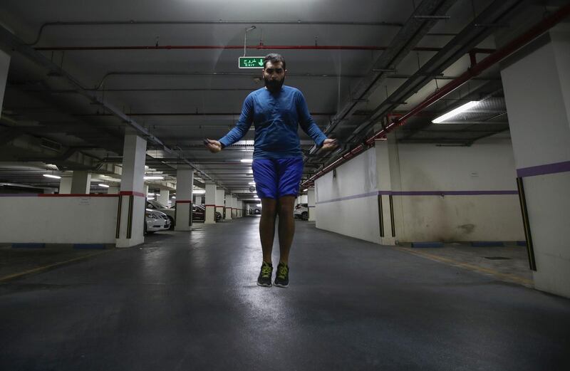 Local Bahraini Mixed Martial Arts (MMA) fighter, Dawood Javed, trains for MMA Championship at his building's basement car park, following the outbreak of the coronavirus, in Manama, Bahrain, May 17, 2020. Reuters