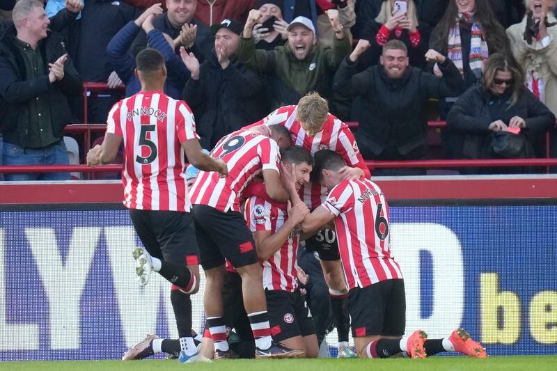 Vitaly Janelt celebrates with his Brentford teammates after scoring against Tottenham. AP