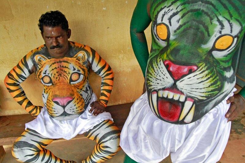 Dancers in body paint wait to take part in a performance. Reuters