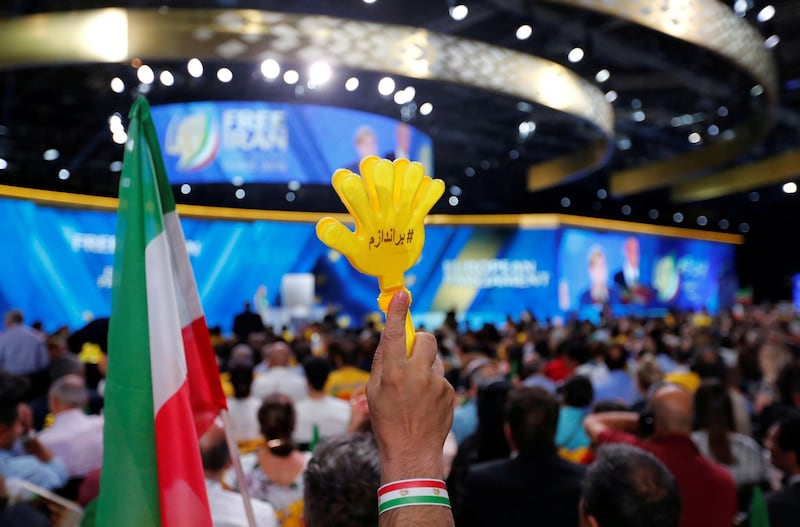 FILE PHOTO: Supporters of Maryam Rajavi, president-elect of the National Council of Resistance of Iran (NCRI), attend a rally in Villepinte, near Paris, France, June 30, 2018.  REUTERS/Regis Duvignau/File Photo