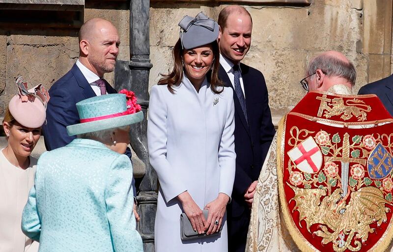 Zara (L) and Mike Tindall, Britain's Catherine, Duchess of Cambridge (C) and Britain's Prince William, Duke of Cambridge (2nd R) stand by as Britain's Queen Elizabeth II arrrives for the Easter Mattins Service at St. George's Chapel, Windsor Castle. Britain's Queen Elizabeth II celebrates her birthday on Sunday, marking 93 years in the public glare.  AFP