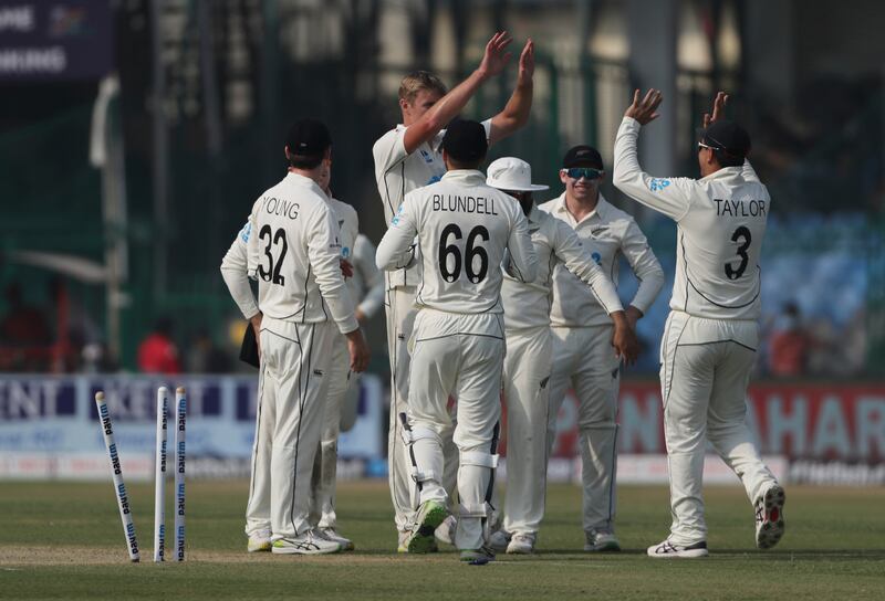 New Zealand players celebrate the dismissal of India's captain Ajinkya Rahane. AP