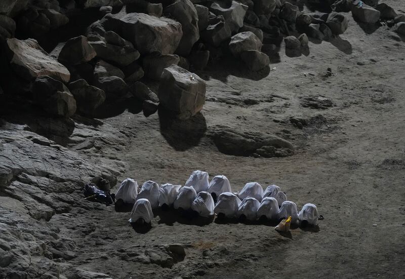Muslim pilgrims pray on the rocky hill known as the Mountain of Mercy. AP Photo