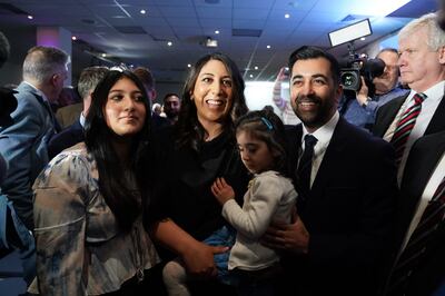 Humza Yousaf with his wife Nadia El Nakla and family after he was announced as SNP leader. PA