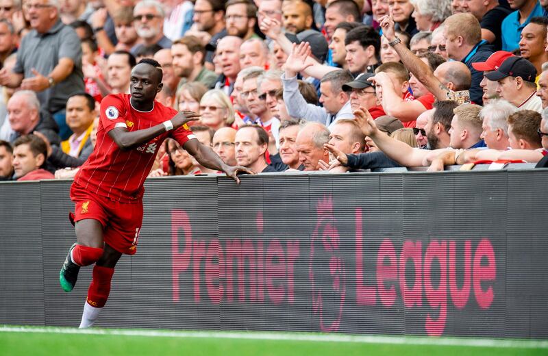 Liverpool's Sadio Mane up against the advertising hoardings. EPA