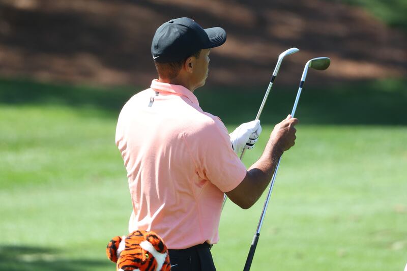 Tiger Woods looks at his clubs during a practice session at Augusta National Golf Club. AFP