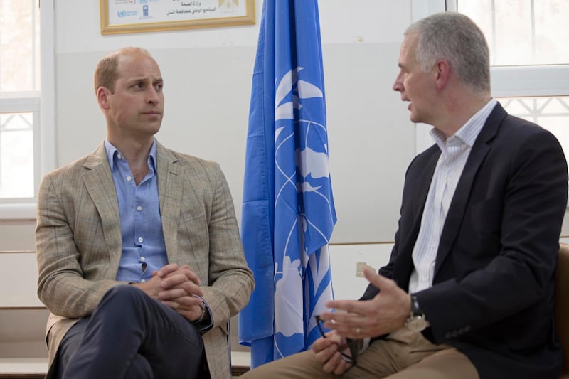 Britain's Prince William receives a briefing by Scott Anderson, the Director of UNRWA Operations in the West Bank, during a visit to a clinic operated by UNRWA inside Al-Jalzoun refugee camp near the West Bank city of Ramallah. Fadi Arouri / AP Photo