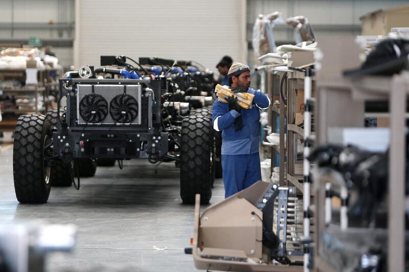 Workers at the NIMR military vehicle production facility in the Tawazun Industrial Park in the Al Ajban area north of Abu Dhabi. Christopher Pike / The National