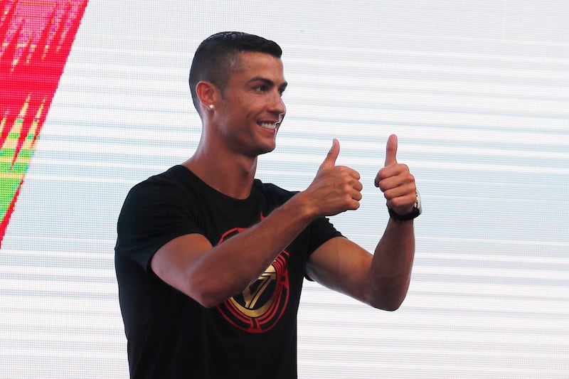 New Juventus football player Cristiano Ronaldo of Portugal greets fans during his visit to Beijing, China, on July 19, 2018. EPA