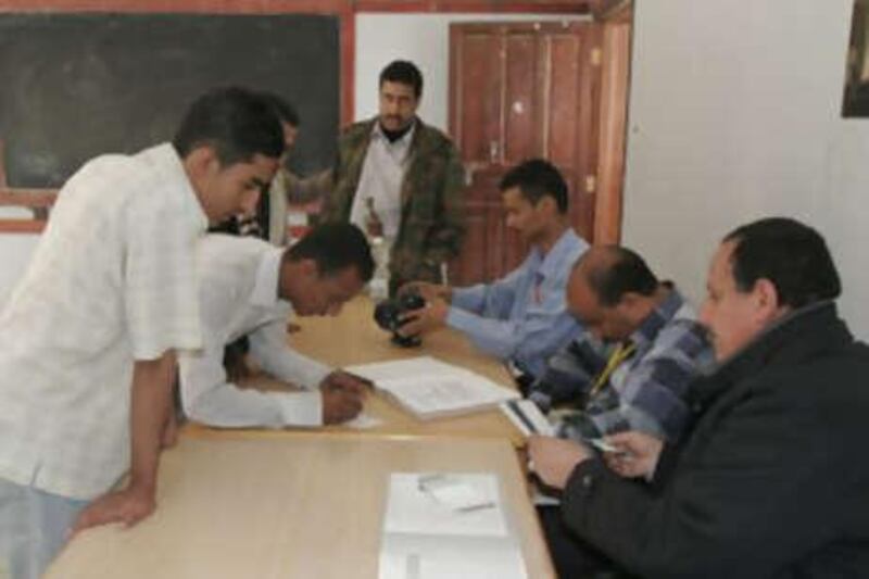 Young Yemenis register their names at the election commission in Sana'a.