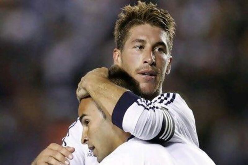 Defender Sergio Ramos, top, expects one or two more additions to the Real Madrid roster in time for the team to start the defence of last year's Primera Liga title.