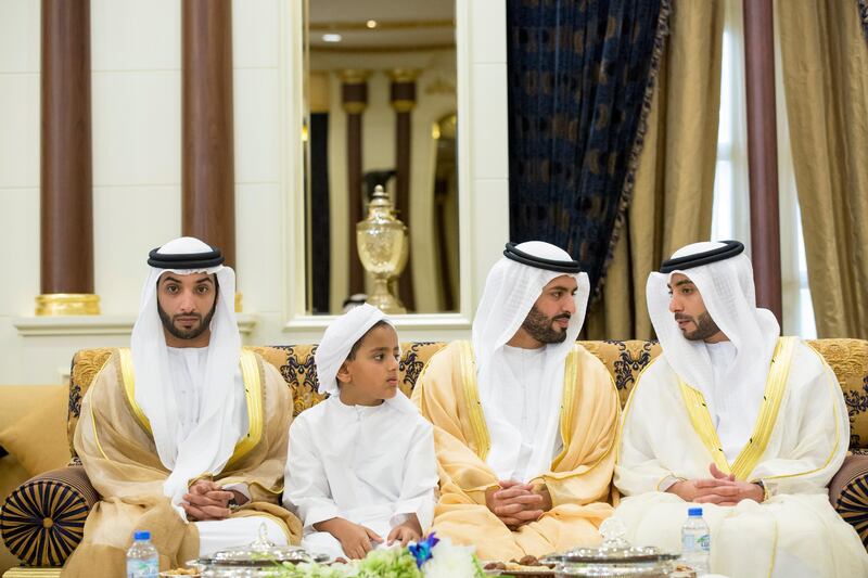ABU DHABI, UNITED ARAB EMIRATES - October 04, 2014: HH Sheikh Khaled bin Sultan bin Zayed Al Nahyan (L), HH Sheikh Zayed bin Mohamed bin Hamed bin Tahnoon Al Nahyan (2nd L), HH Sheikh Mohamed bin Hamad bin Tahnoon Al Nahyan (3rd L), and HH Dr Sheikh Hazza bin Sultan bin Zayed Al Nahyan (R), attend an Eid Al Adha reception, at Al Mushrif palace.
( Ryan Carter / Crown Prince Court - Abu Dhabi )
---