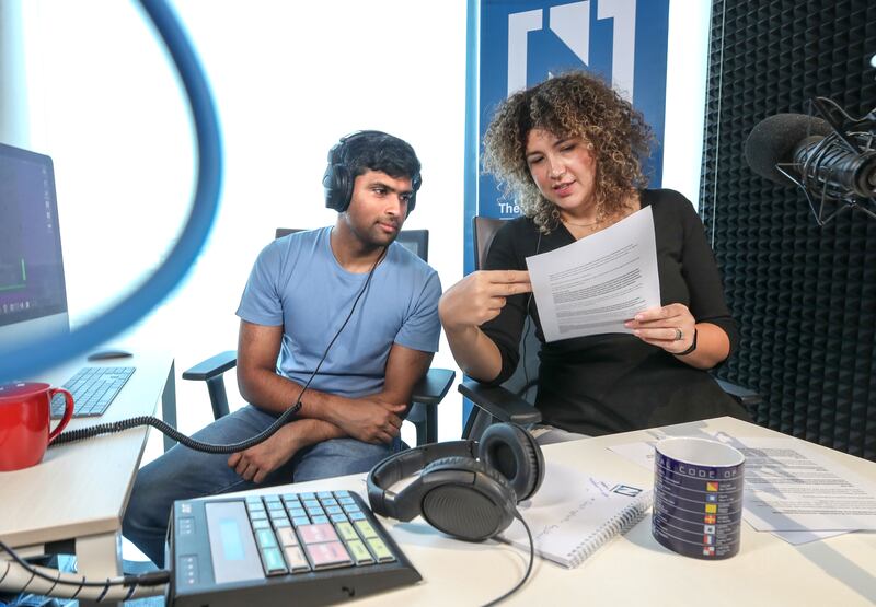 Head of Multimedia Enas Refaei in The National's podcast studio with producer Arthur Pereira. Victor Besa / The National