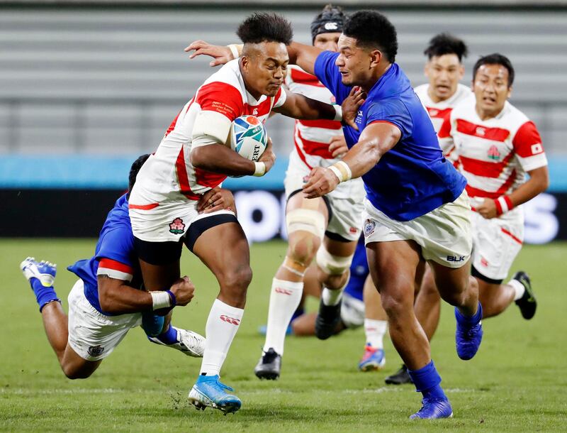 Japan's Kotaro Matsushima runs into the Samoan defence at City of Toyota Stadium. Associated Press