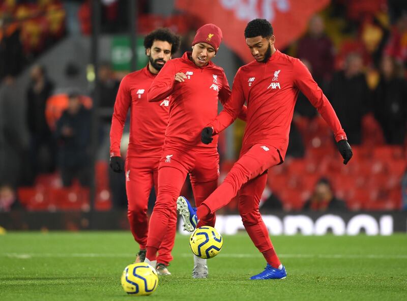 Mohamed Salah, Roberto Firmino and Joe Gomez of Liverpool warm up prior to the Mersey derby. Getty