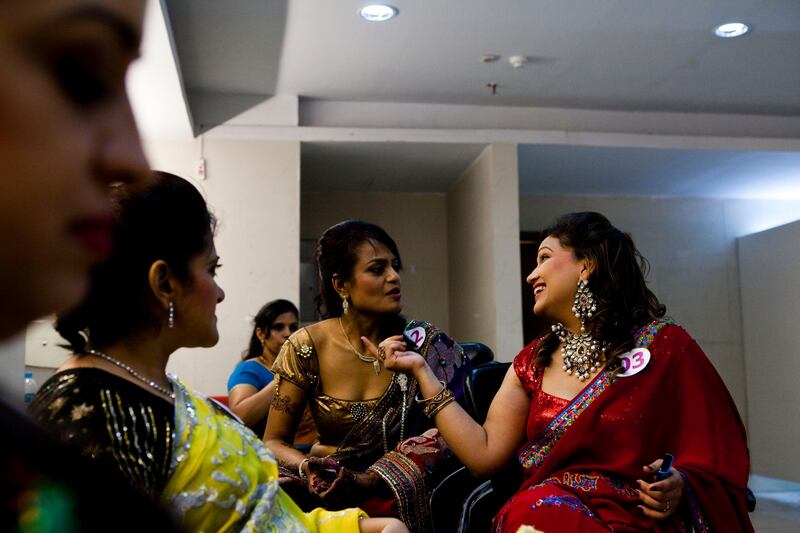 Contestants chat with each other backstage as they wait for the announcement on the finalists at the inaugural AAS Housewives Awards 2012 on 19th May 2012 in New Delhi, India. Photo by Suzanne Lee for The National