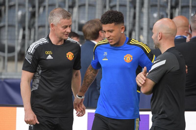 Ole Gunnar Solskjaer and Jadon Sancho. AFP