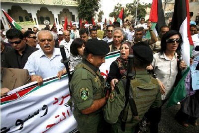 Palestinians protest against the peace negotiations brokered by the US in the West Bank city of Hebron.