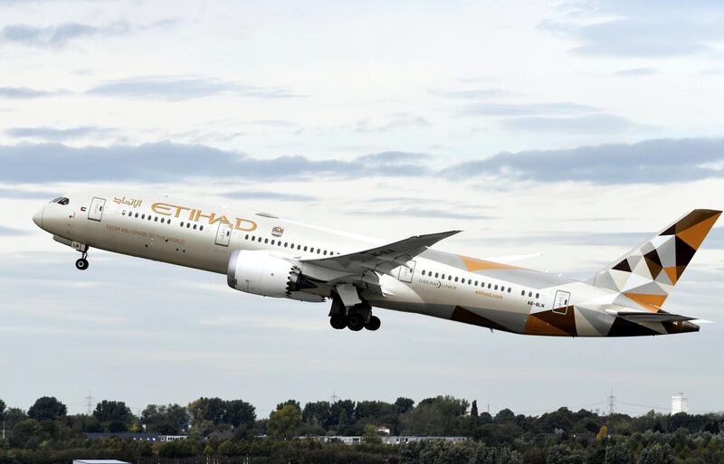 This picture shows a Boeing 787-10 Dreamliner of the Etihad airline during take-off on September 24, 2019 at the airport in Duesseldorf, western Germany. (Photo by INA FASSBENDER / AFP)