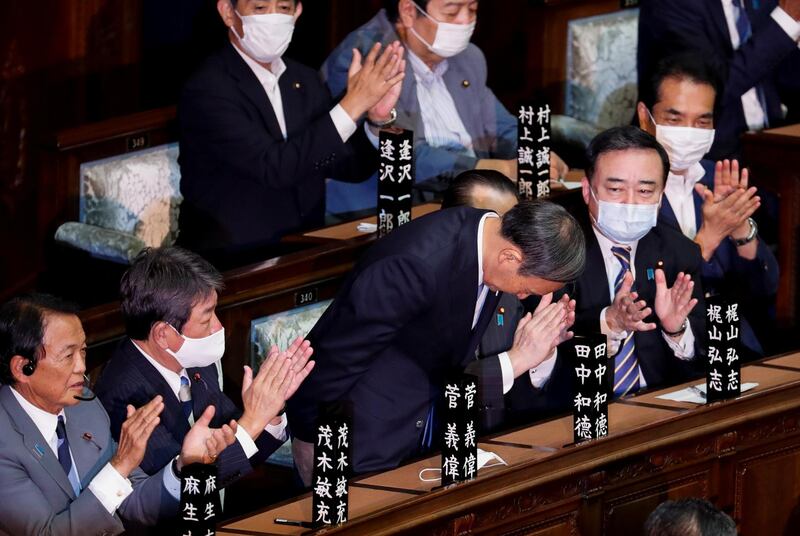 Japan's newly-elected Prime Minister Yoshihide Suga bows as he was chosen as the new prime minister at the Lower House of the Parliament in Tokyo. REUTERS